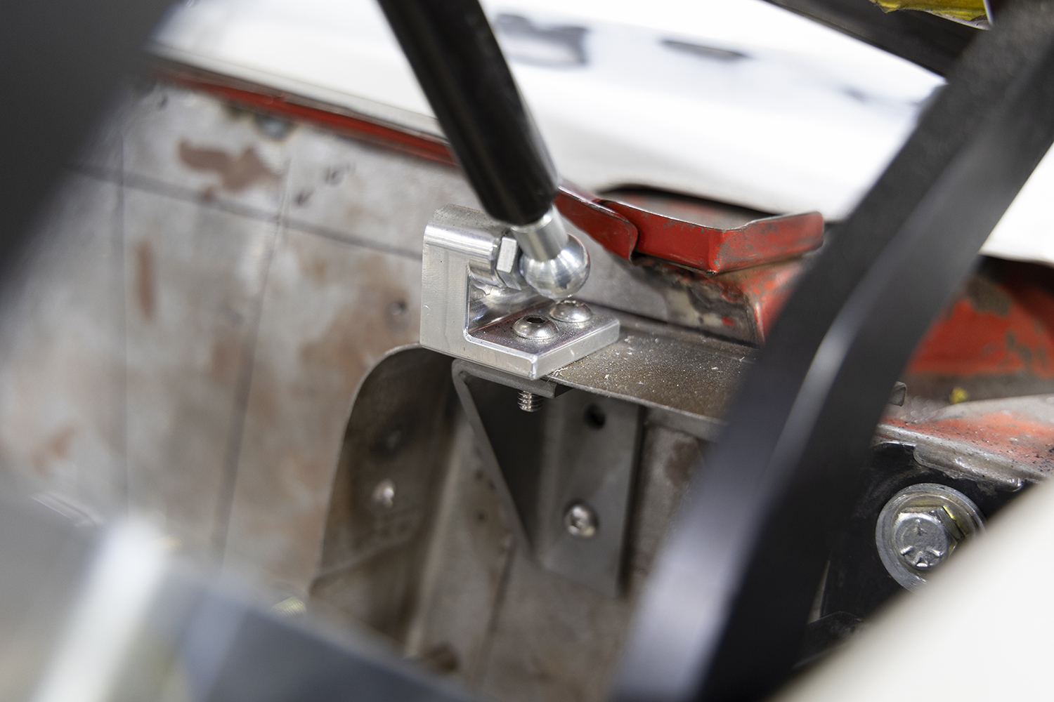 21 Billet gas strut mount installed on a 1962 Chevy Impala trunk hinge