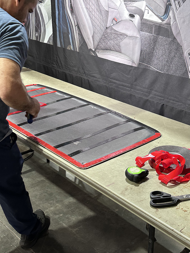 23 Adhesive strips applied to headliner backing for secure mounting