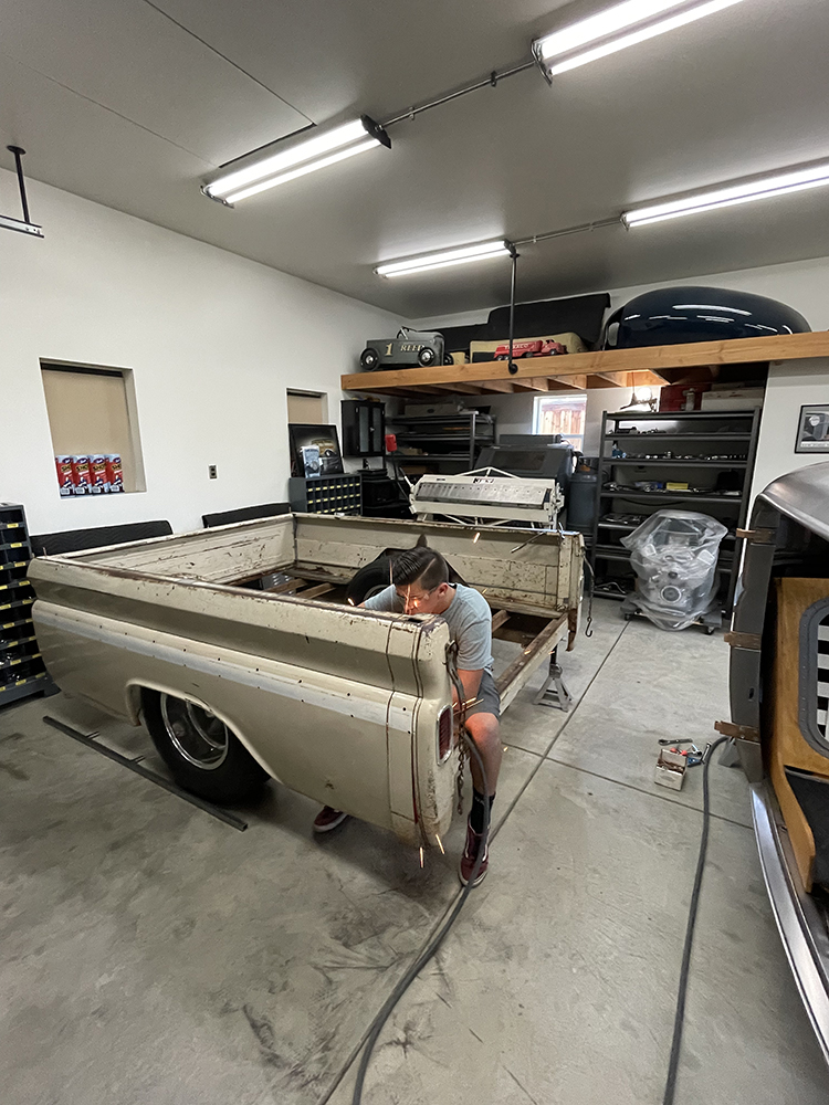 23 working on the truck bed prepping it for further restoration