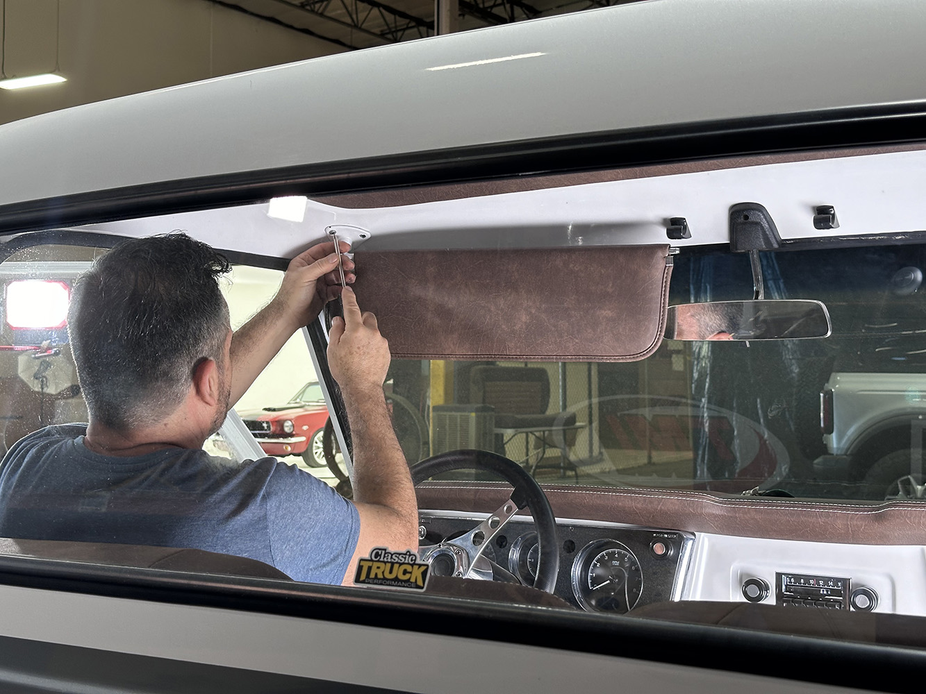 26 Sun visor being mounted to complete the interior restoration