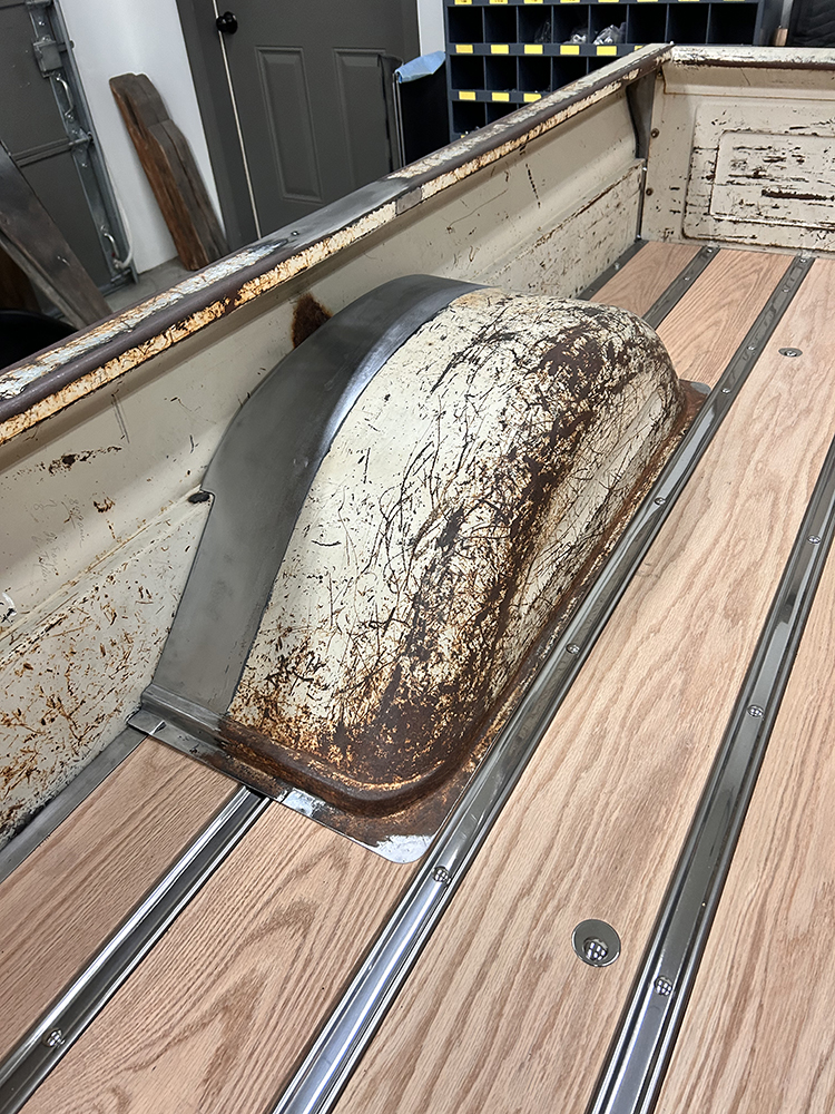 26 close up of the original wheel well with patina and new wood bed floor