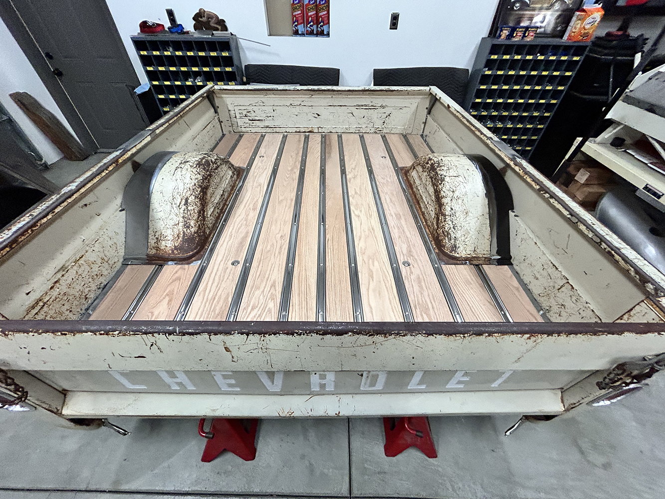 27 fully assembled truck bed featuring a rustic patina and fresh wood floorboards