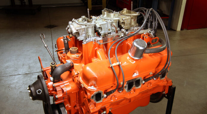 00 Mopar 340 small block V8 with Six Pack carb setup classic orange paint early 1970s performance build