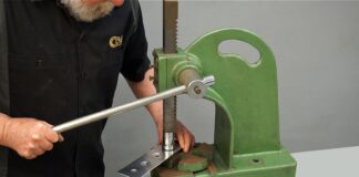 00 Using a manual arbor press to create dimples in a sheet metal panel