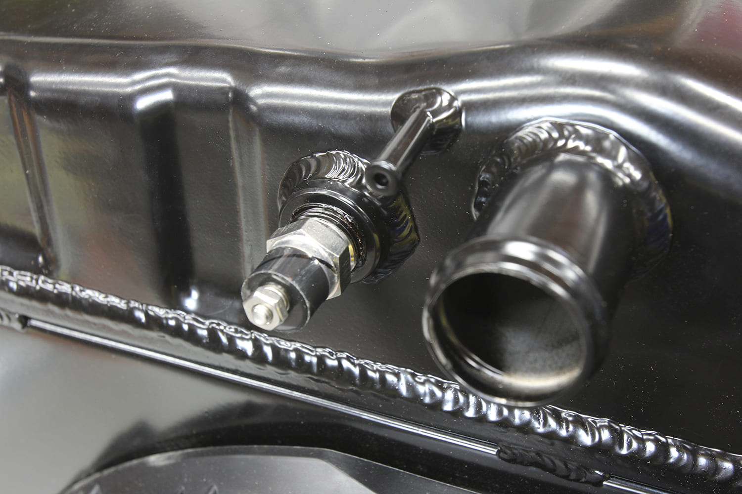 002 Close up of radiator fittings and overflow tube