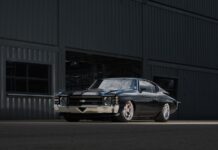 003 1971 Chevrolet Chevelle SS parked in an industrial setting highlighting its lowered suspension and wide wheels
