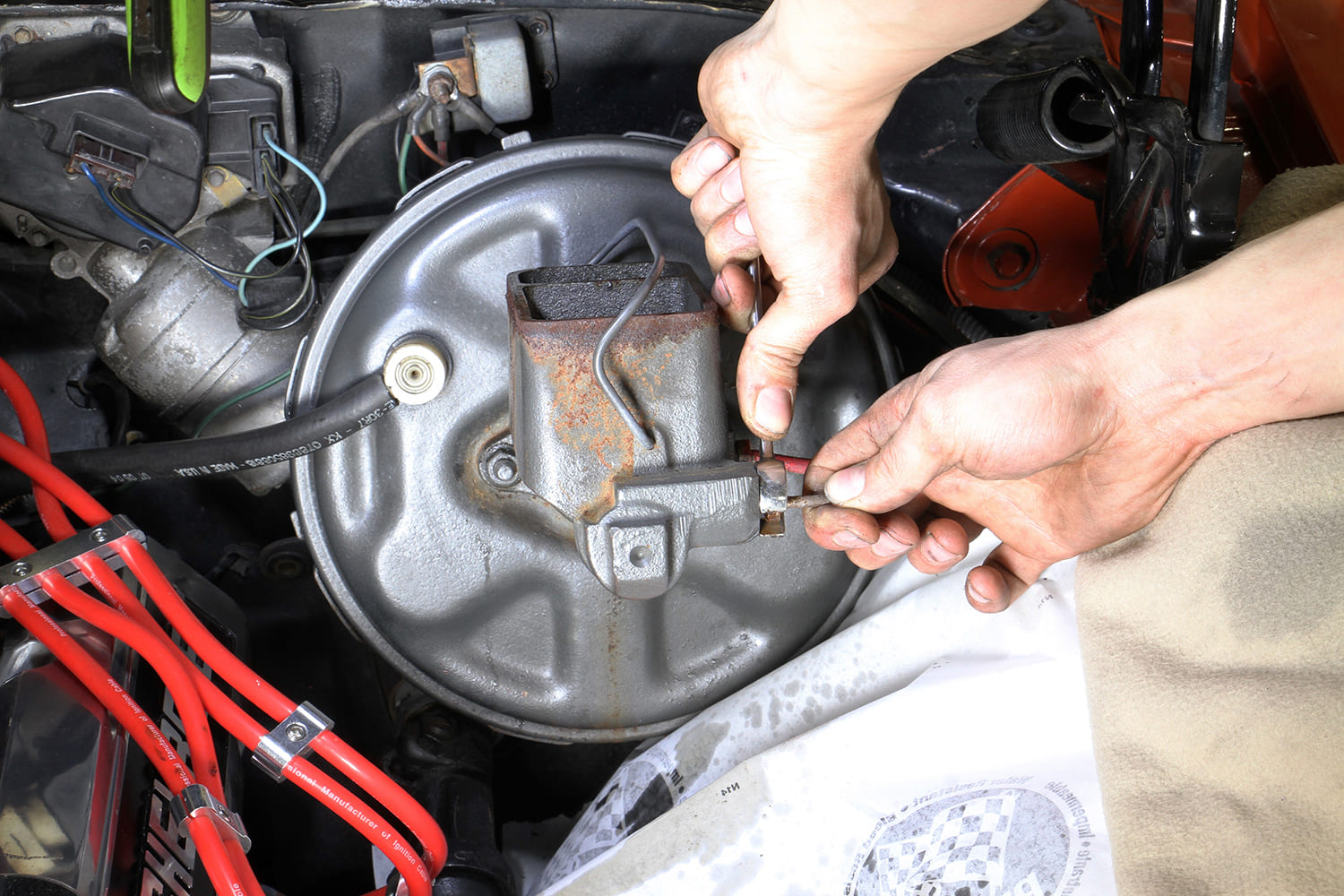 006 Mechanic disconnecting brake lines from a rusted master cylinder