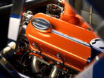 007 1966 Chevy Nova close up of the orange valve covers with chrome accents