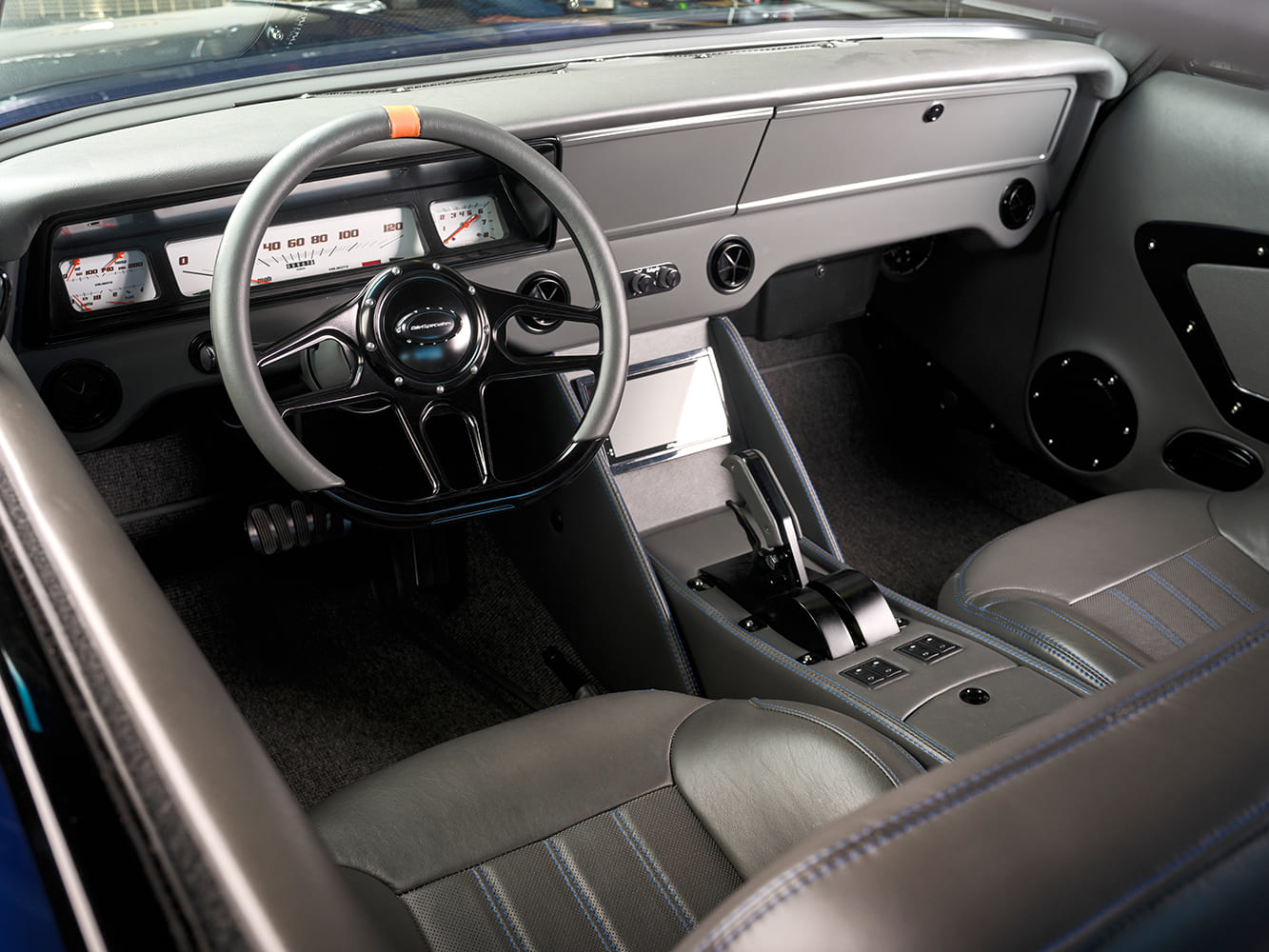 009 1966 Chevy Nova modern interior with a leather wrapped dash and digital gauges