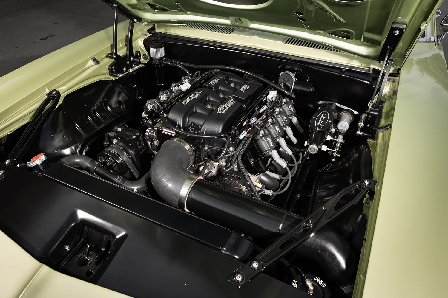 009 1969 Chevy Camaro SS engine bay with modern LS3 V8 and custom intake