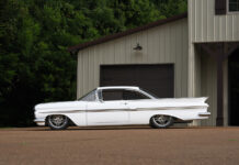 01 1959 Chevy Impala lowered on custom wheels with a clean white finish and sleek body lines
