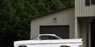 01 1959 Chevy Impala lowered on custom wheels with a clean white finish and sleek body lines