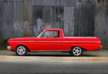 01 1965 Ford Ranchero red paint chrome trim Torq Thrust wheels corrugated wall backdrop