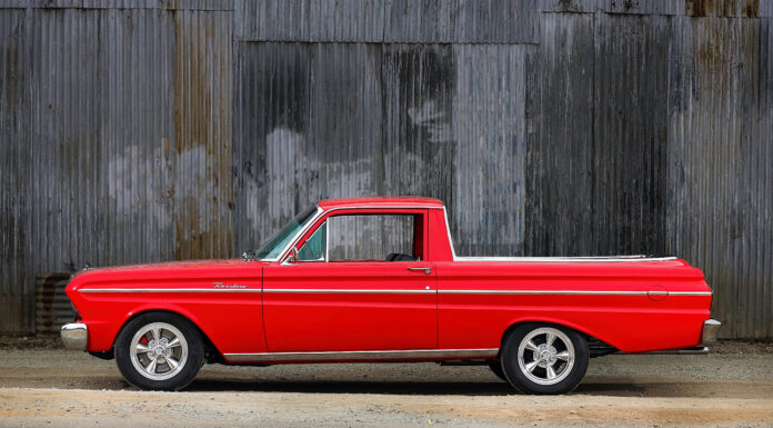 01 1965 Ford Ranchero red paint chrome trim Torq Thrust wheels corrugated wall backdrop