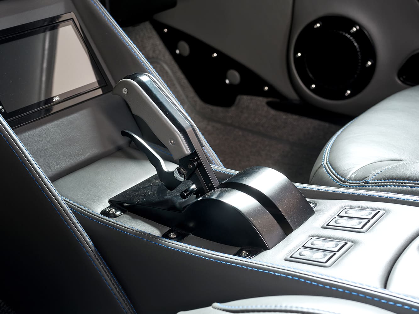 010 1966 Chevrolet Nova center console featuring a race style shifter and touchscreen display