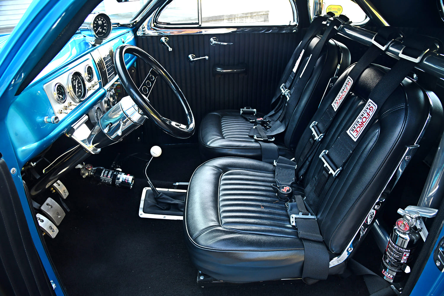 013 1939 Chevy Gasser interior featuring black bucket seats with G Force racing harnesses
