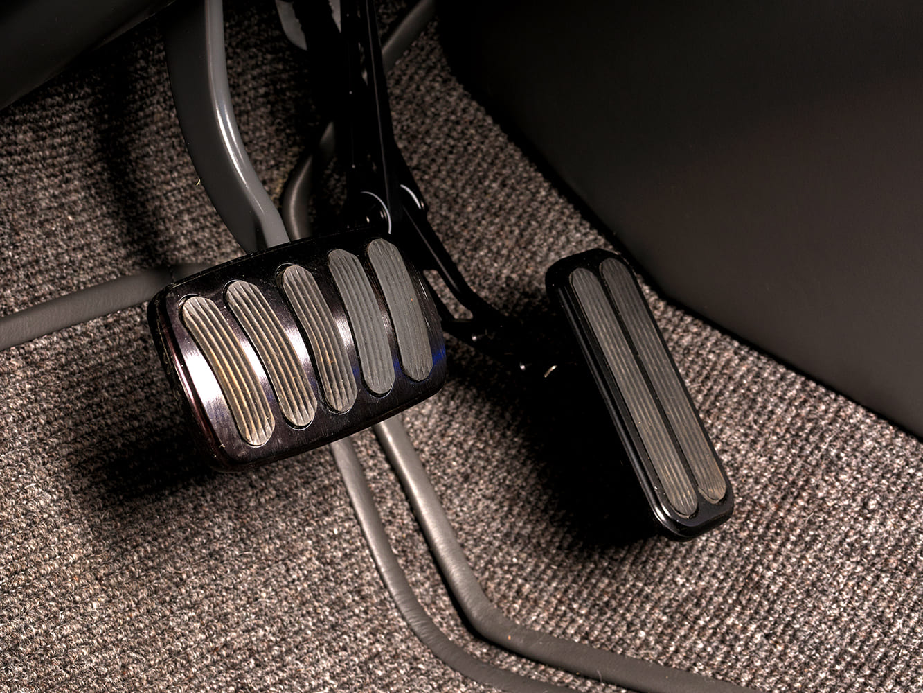 013 1966 Chevy Nova black billet aluminum brake and accelerator pedals on custom carpeting
