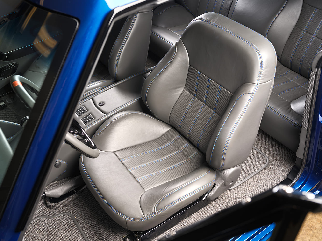 014 1966 Chevrolet Nova custom gray leather seats with blue stitching and bolstered design