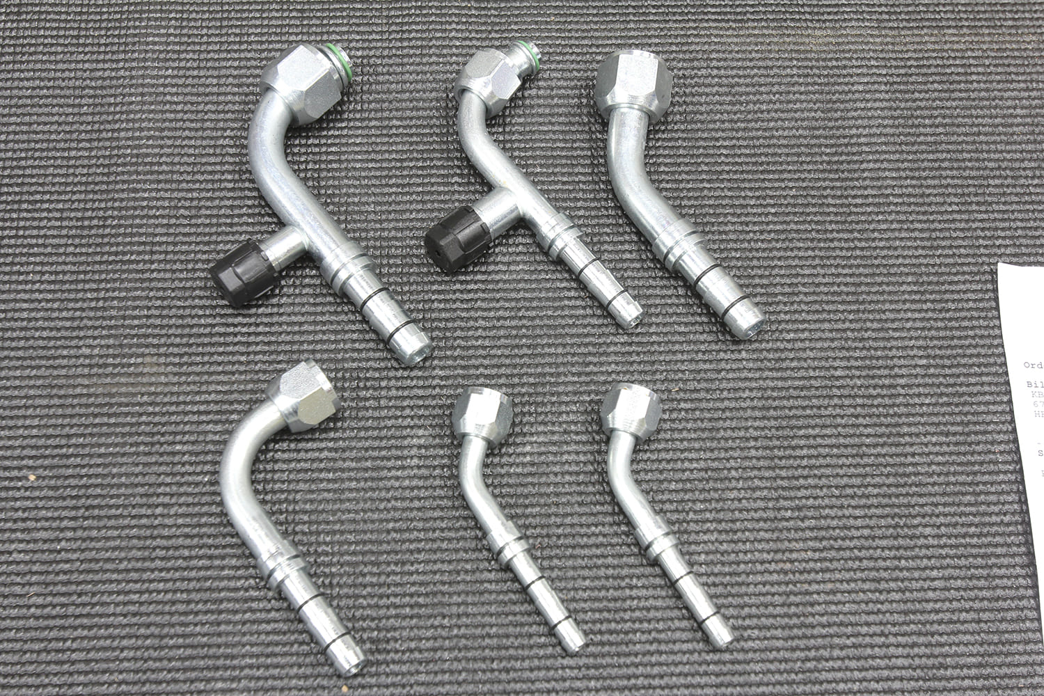 014 Various AC hose fittings and adapters laid out