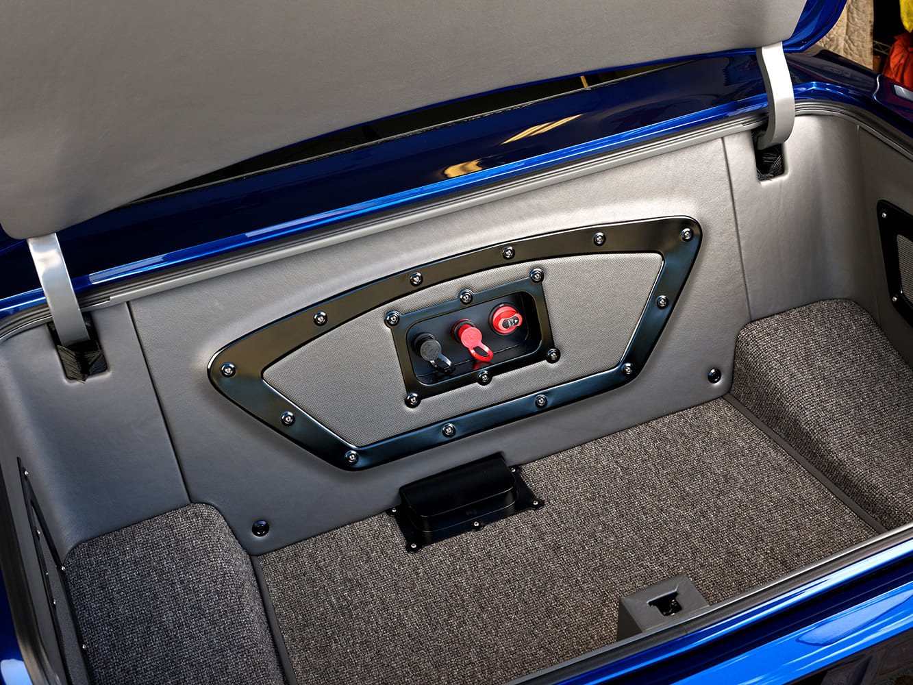 015 1966 Chevy Nova fully customized trunk interior with a battery disconnect switch panel