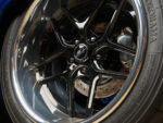 016 1966 Chevrolet Nova close up of multi spoke black and chrome wheels with Wilwood disc brakes