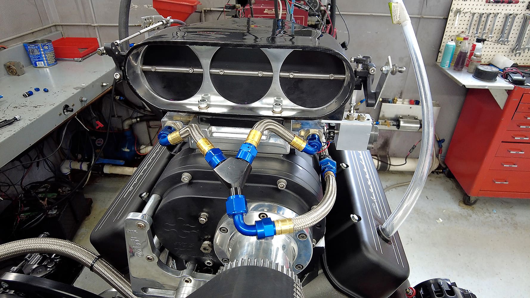 019 Close up supercharged big block Chevy triple throttle intake fuel injection race ready setup