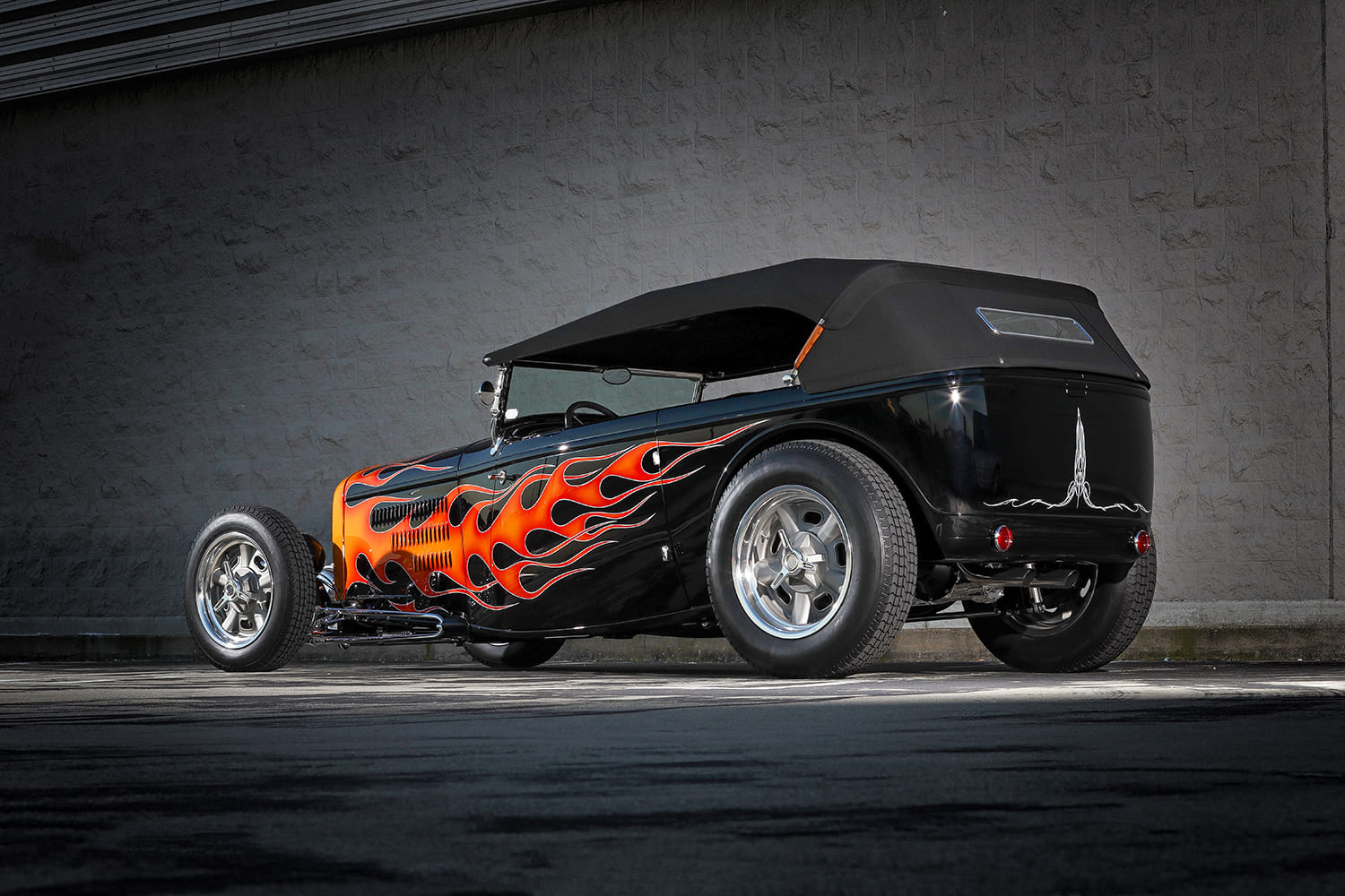 02 1932 Ford Highboy Roadster with black soft top and flamed bodywork in traditional hot rod style