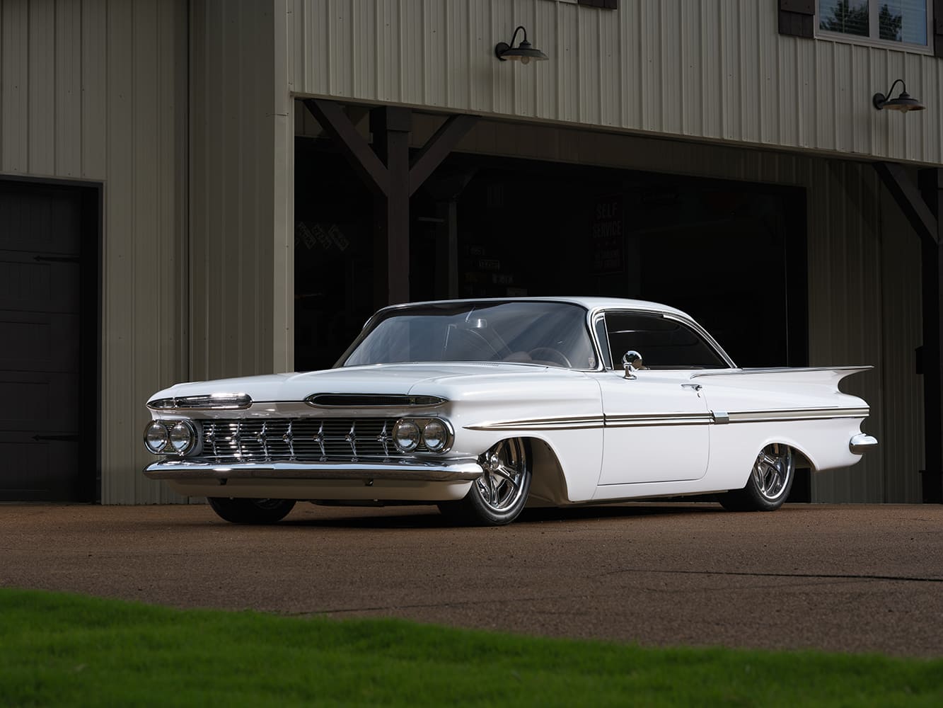 02 Front view of 1959 Chevy Impala showcasing quad headlights and wide chrome grille