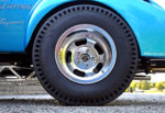 020 1939 Chevrolet Gasser rear wheel with vintage drag racing slicks and slotted aluminum rims