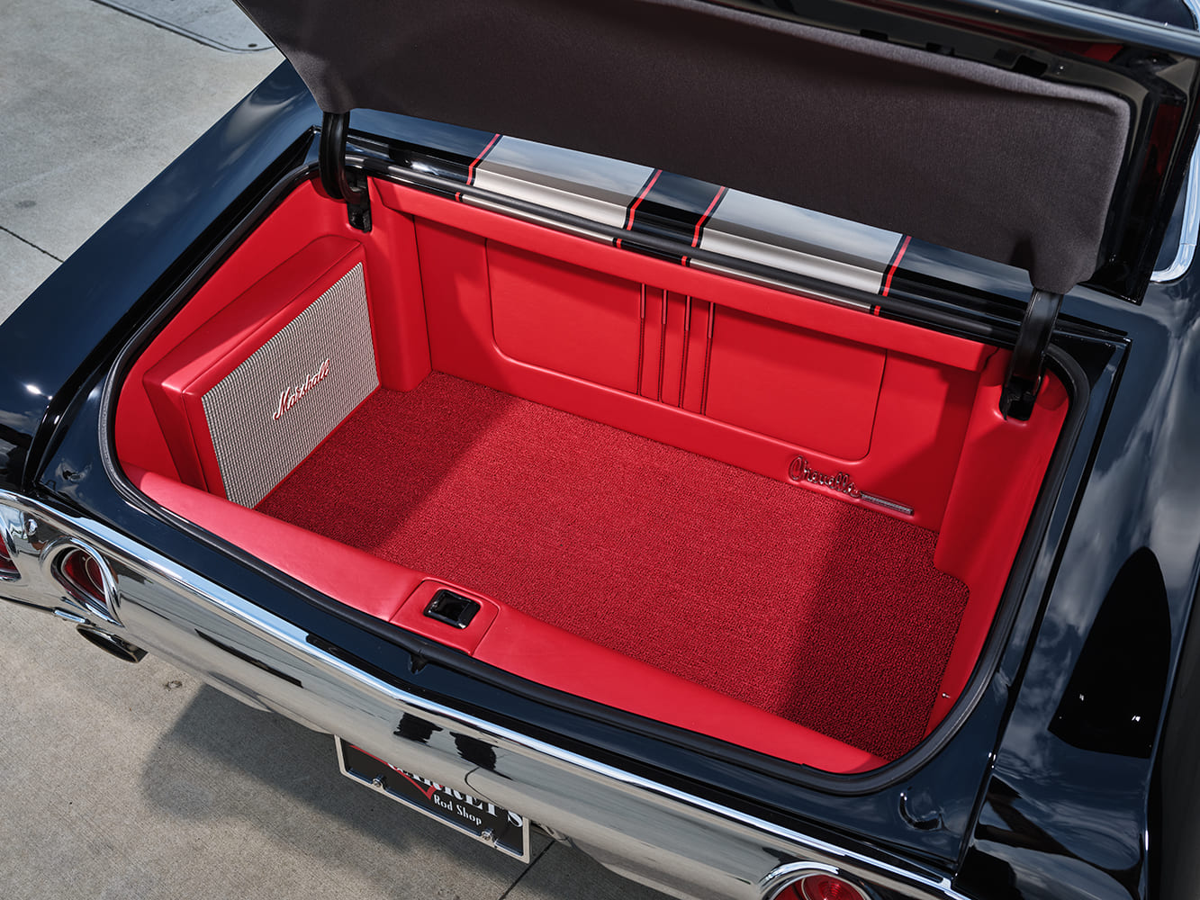 020 1971 Chevy Chevelle SS trunk lined in red with a custom Marshall speaker enclosure
