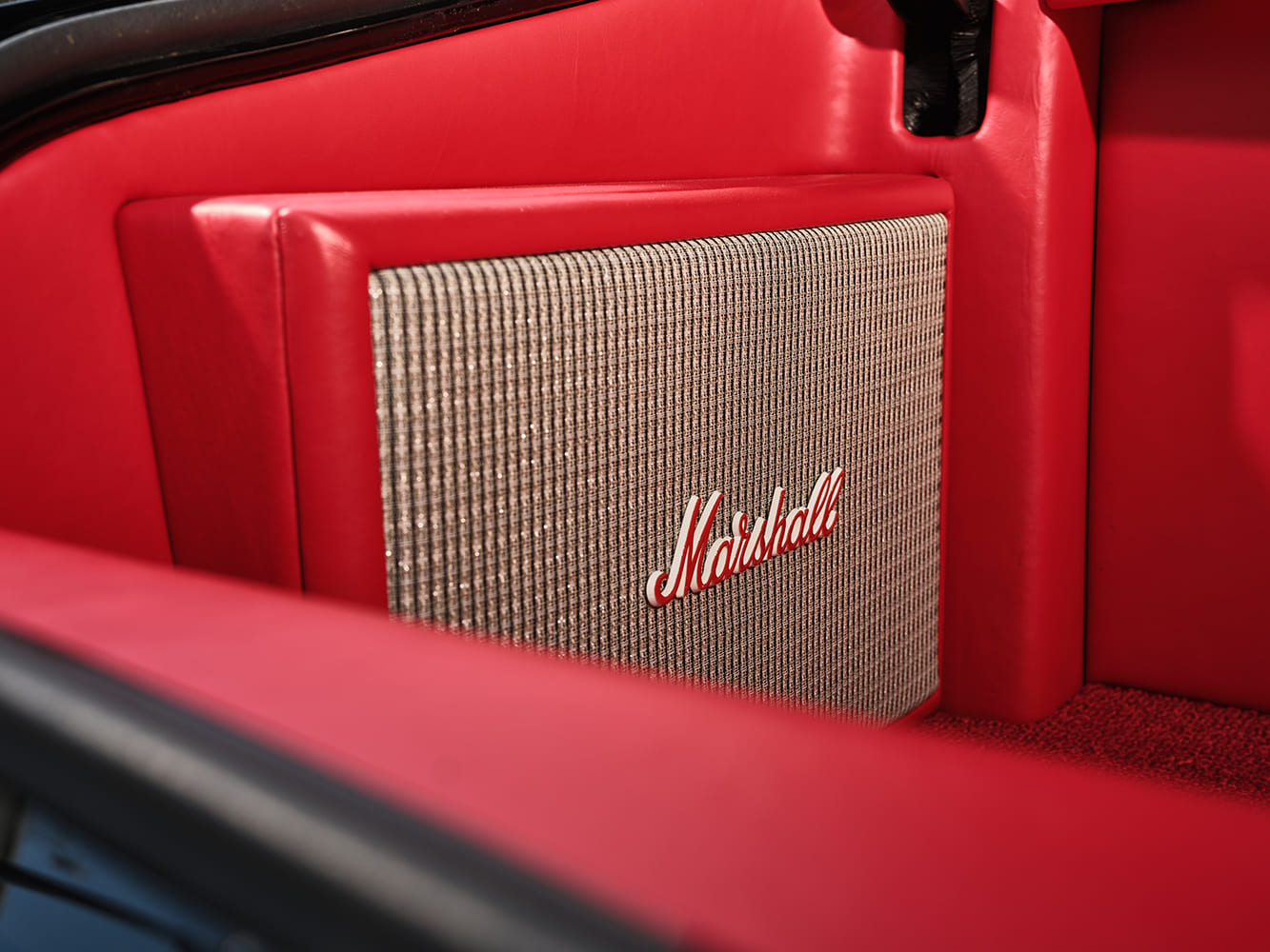 021 1971 Chevrolet Chevelle SS trunk with a custom Marshall speaker integrated into the red leather interior