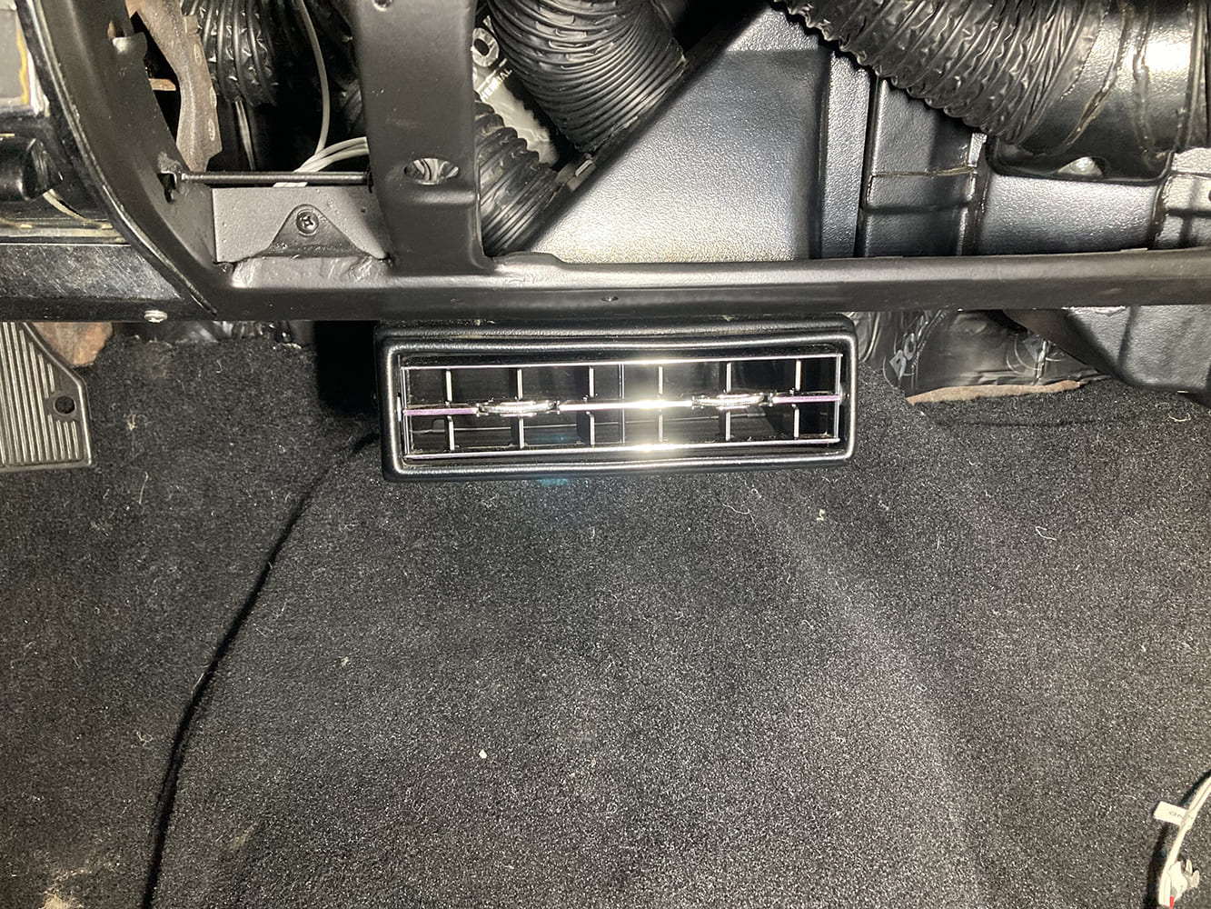 024 Centered AC vent installed under the dash for airflow distribution