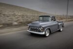 03 1957 Chevrolet Task Force pickup rolling shot with lowered stance and polished wheels