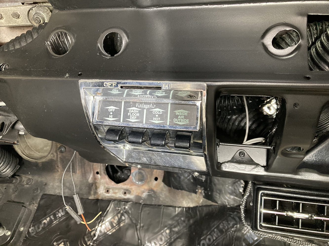 030 Vintage Air control panel installed in the dashboard with additional vent and wiring modifications in progress