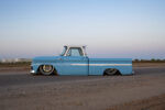 04 1965 Chevrolet C10 profile view slammed with polished wheels and trim