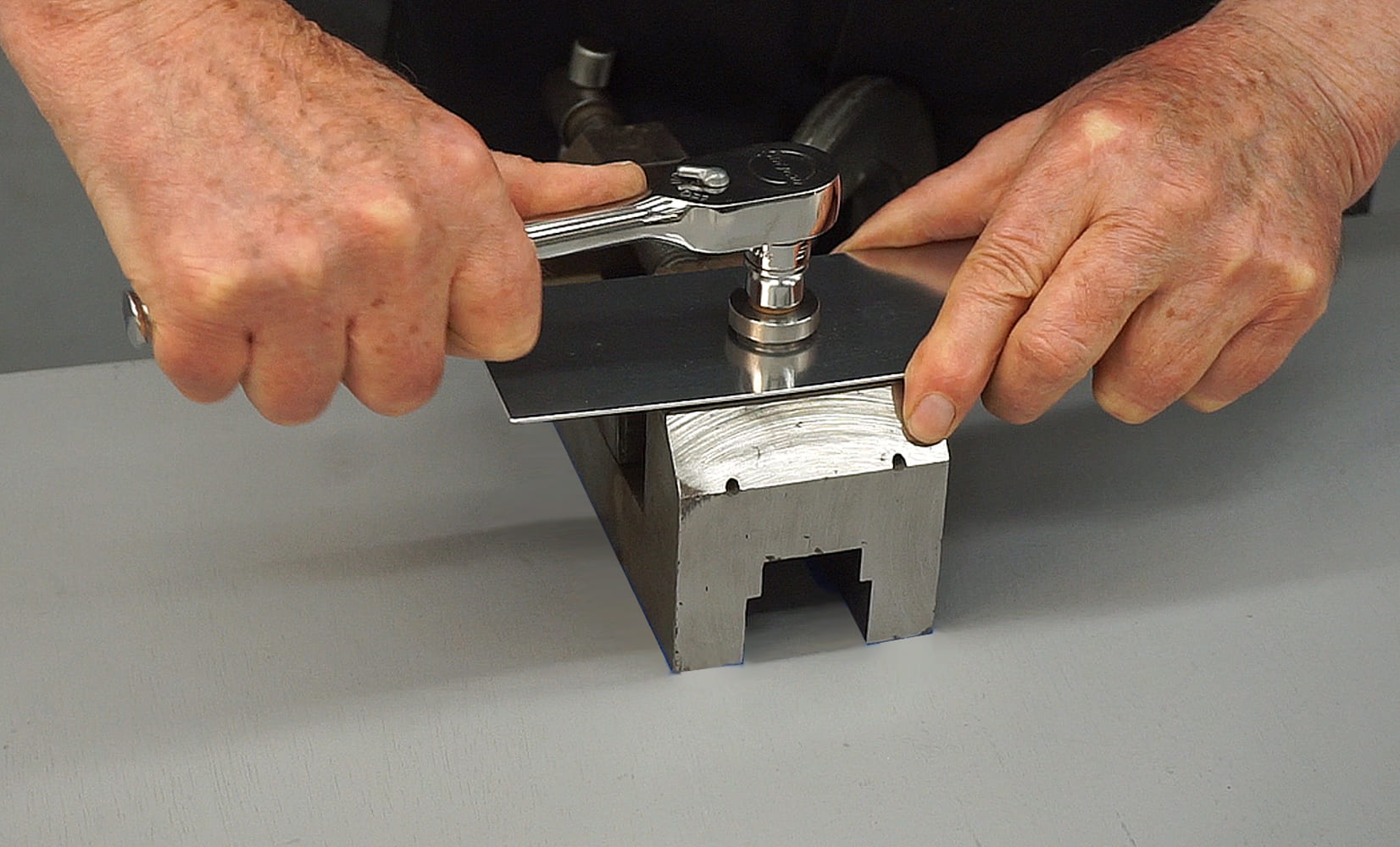 04 Ratchet and dimple die setup forming a hole in a metal piece