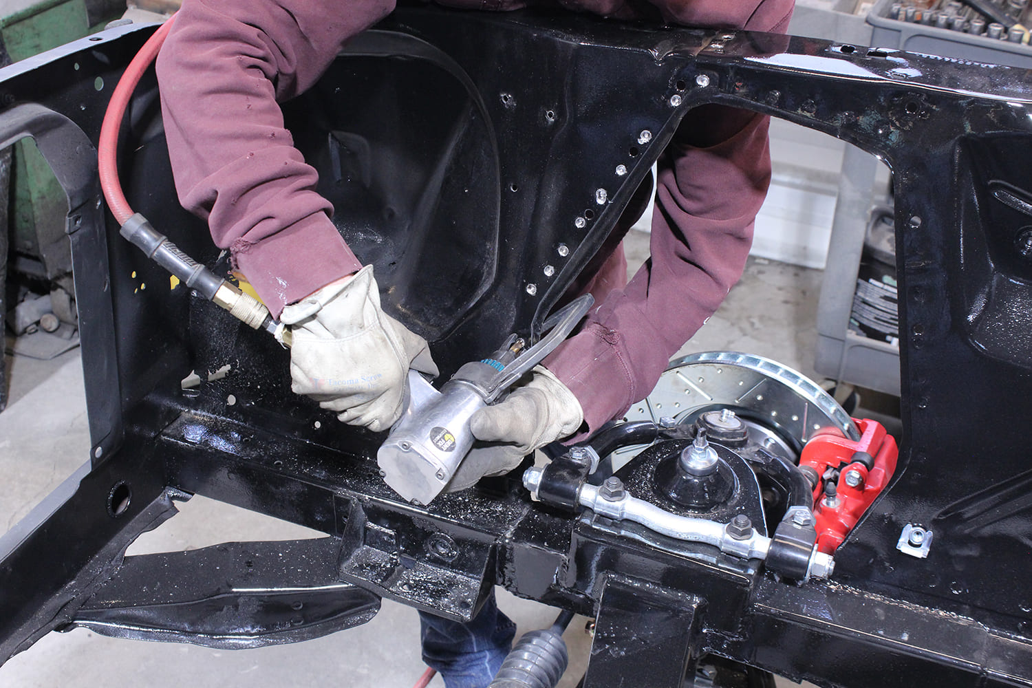 04 Removing apron spot welds from Ford Mustang inner fender with air hammer and safety gear