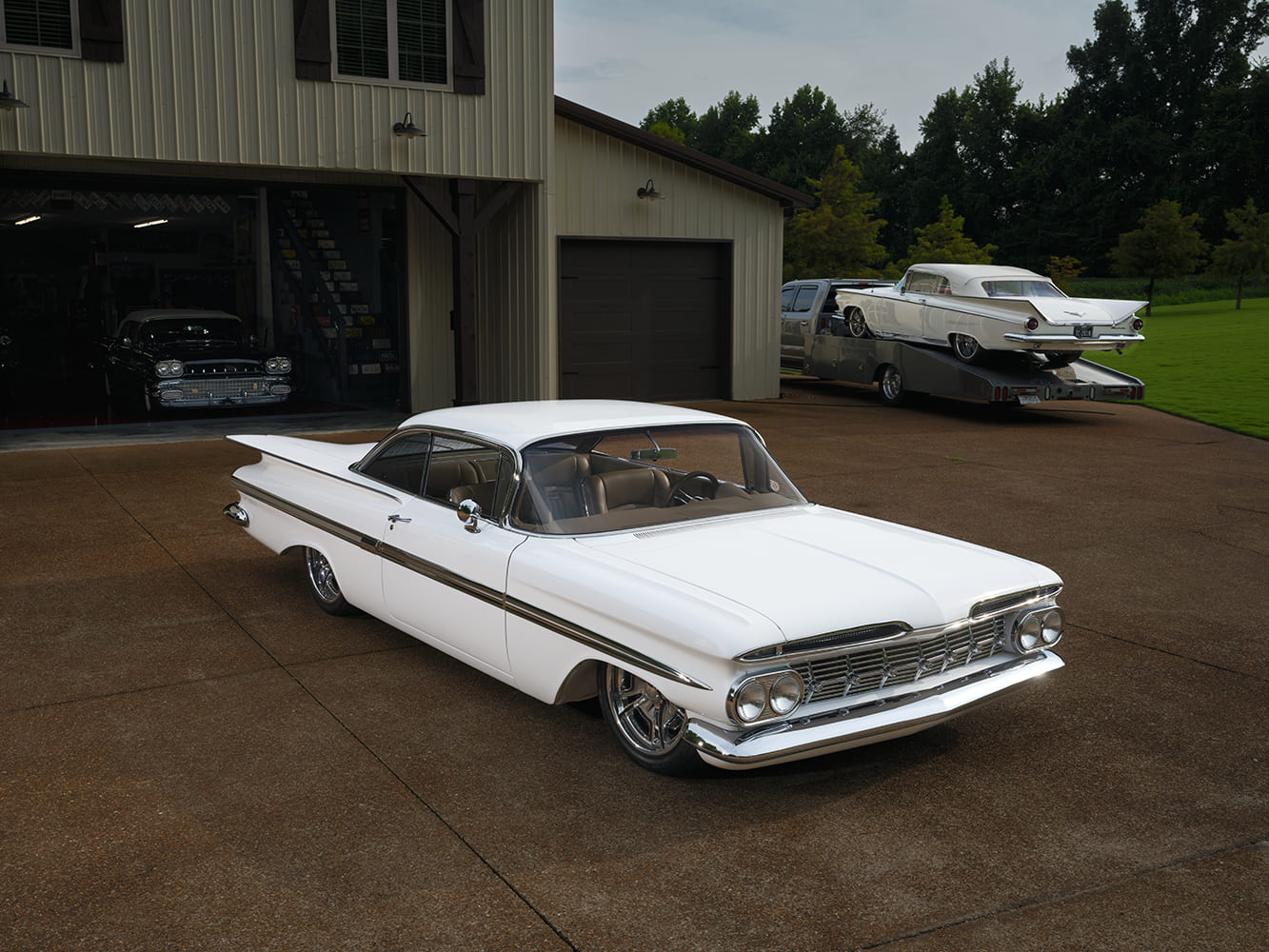 05 Aerial front three quarter view of 1959 Impala emphasizing sculpted fenders and dual antennas