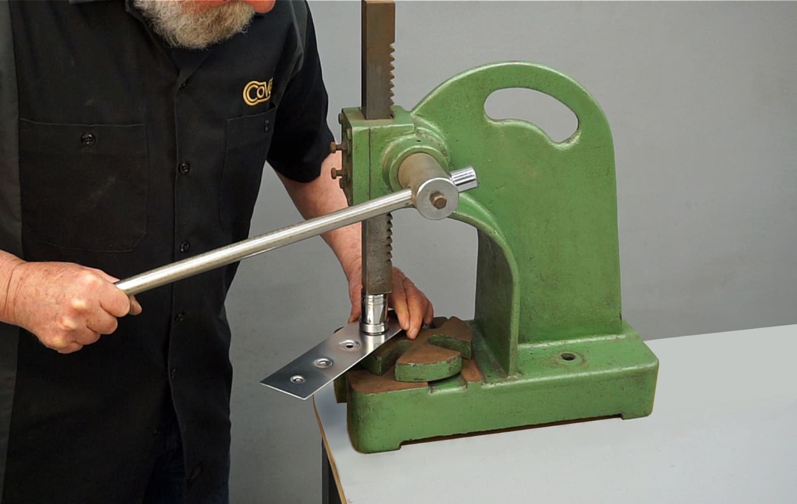 05 Close up of the arbor press setup with dimple dies and a sample panel