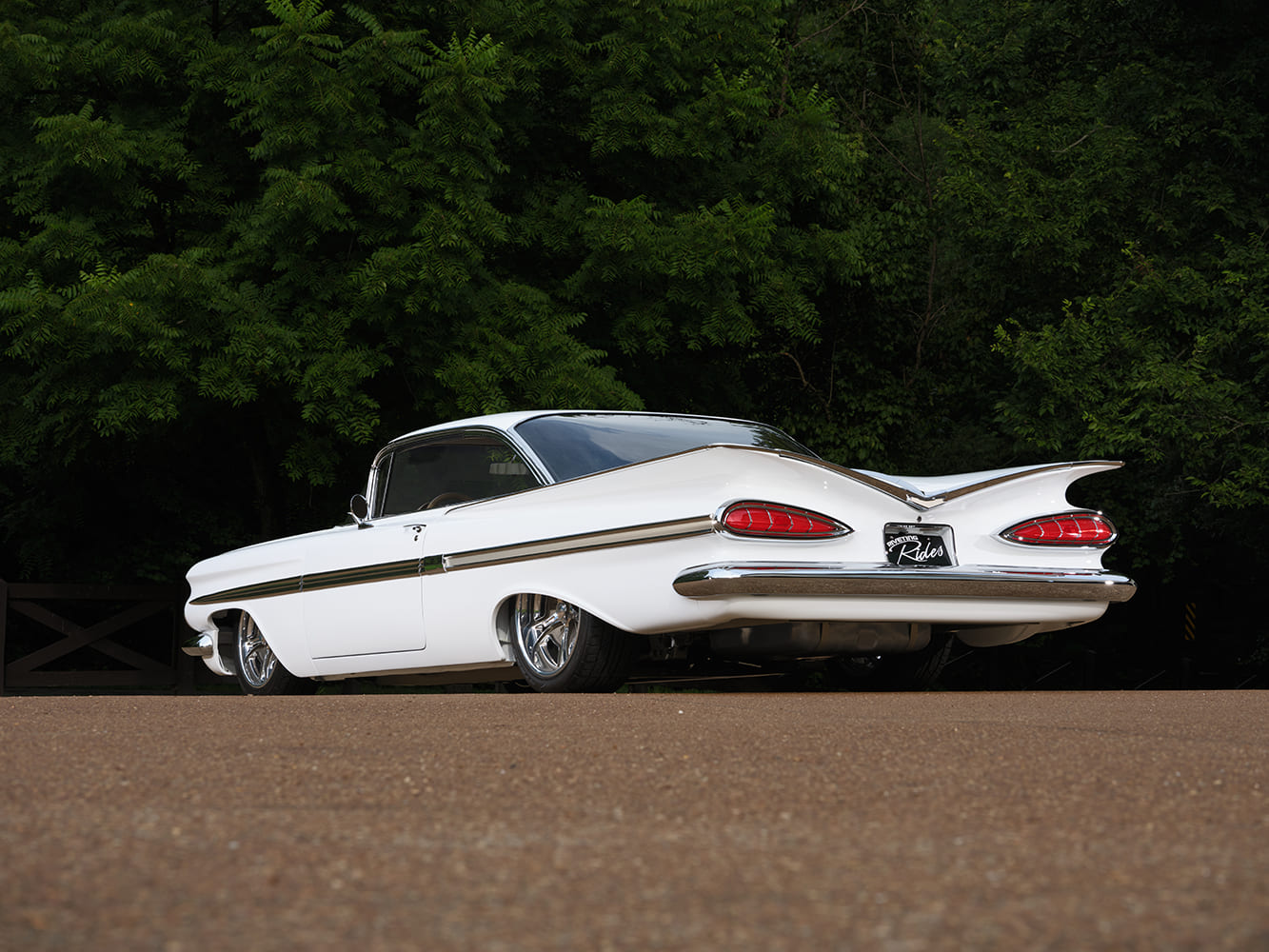 06 Rear low angle of 1959 Impala highlighting iconic cat eye taillights and sweeping fins