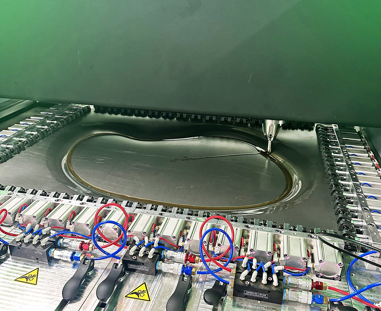 07 Water jet contours the fender panel’s perimeter before deep draw begins