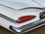 08 Close up of 1959 Chevy Impala taillight detailing chrome trim and vivid red lenses