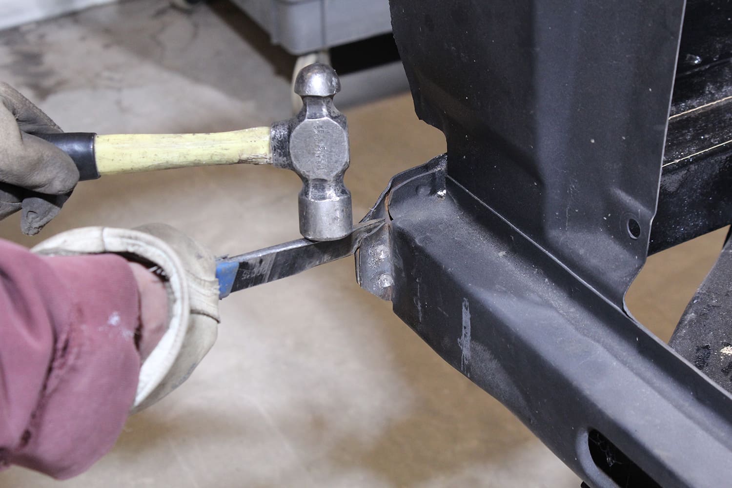 08 Close up of spot weld drill on lower radiator bracket of Ford Mustang core support