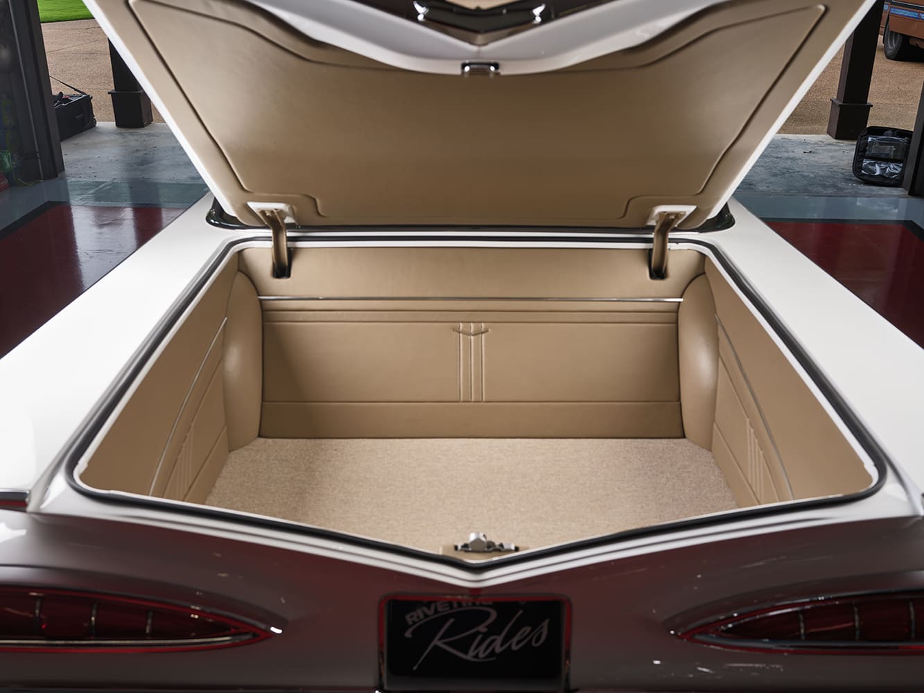 09 Trunk view of 1959 Impala fully upholstered in tan leather with custom paneling