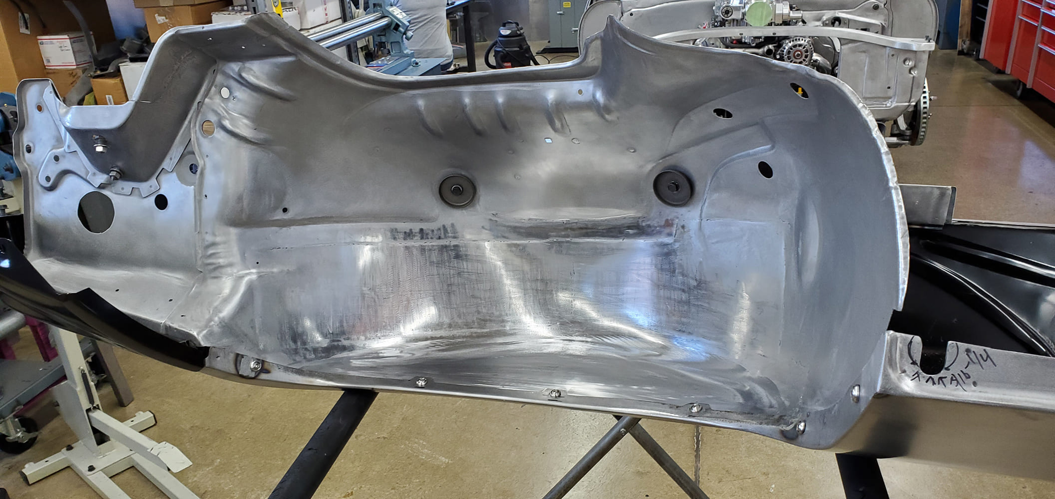 11 1969 Camaro inner fender well smoothed and prepped in bare metal