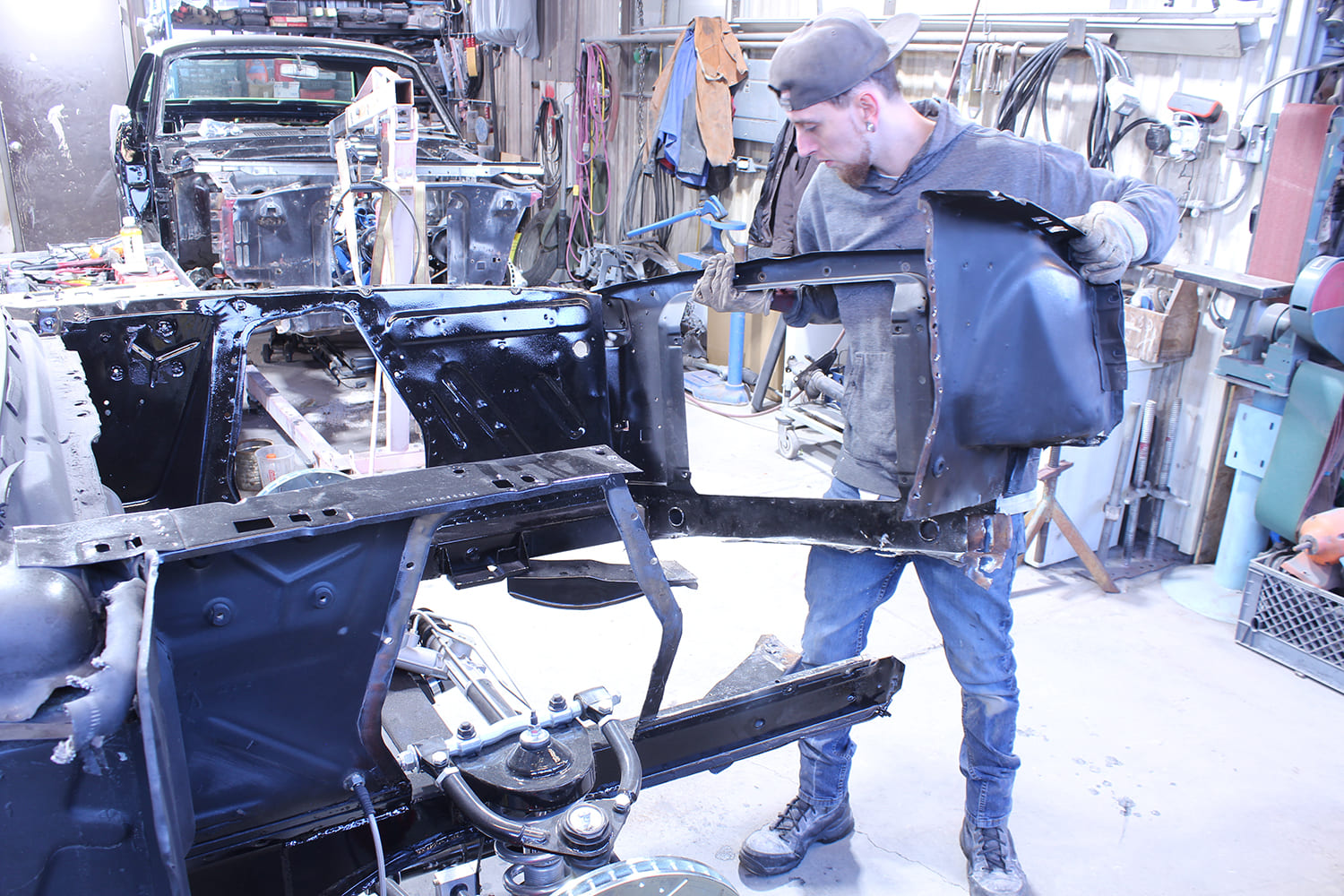 11 Technician removing passenger side apron from 1965 66 Ford Mustang during core support disassembly
