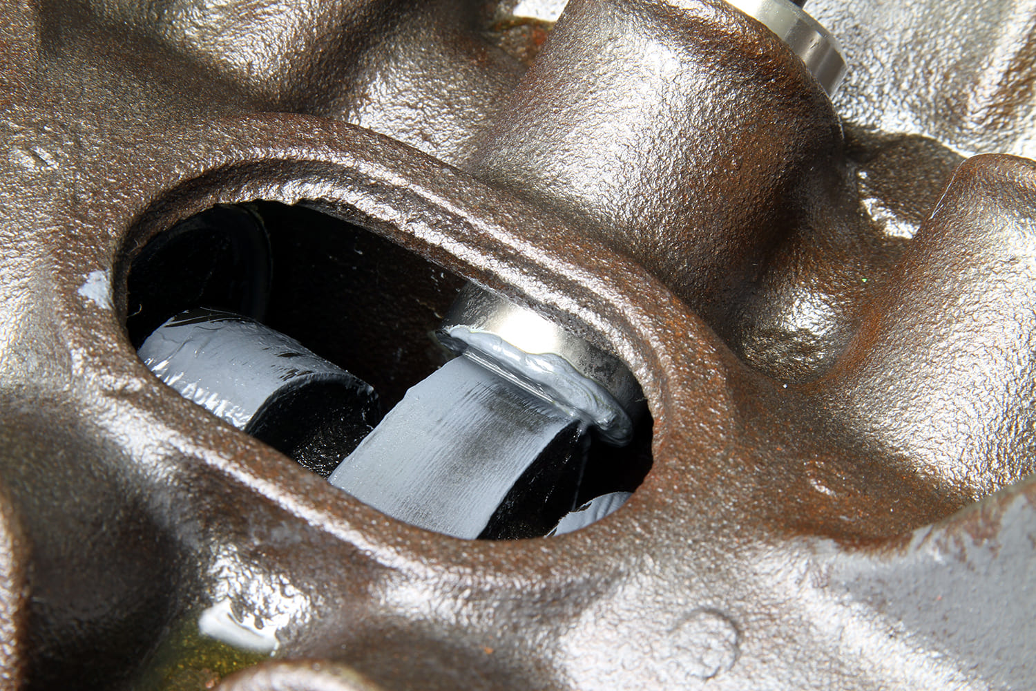 11 View through lifter bore shows camshaft lobe and journal lubrication on 340 block