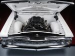 12 Full bay view of 1959 Impala featuring a supercharged LS engine in a smoothed white engine bay