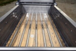 13 1957 Chevrolet custom wood bed with polished stainless steel strips and flush fuel filler