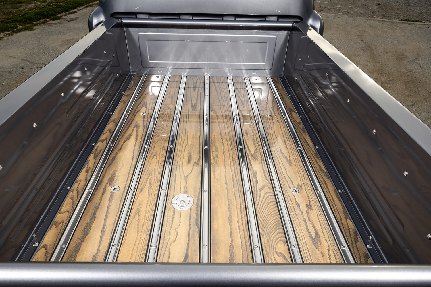 13 1957 Chevrolet custom wood bed with polished stainless steel strips and flush fuel filler